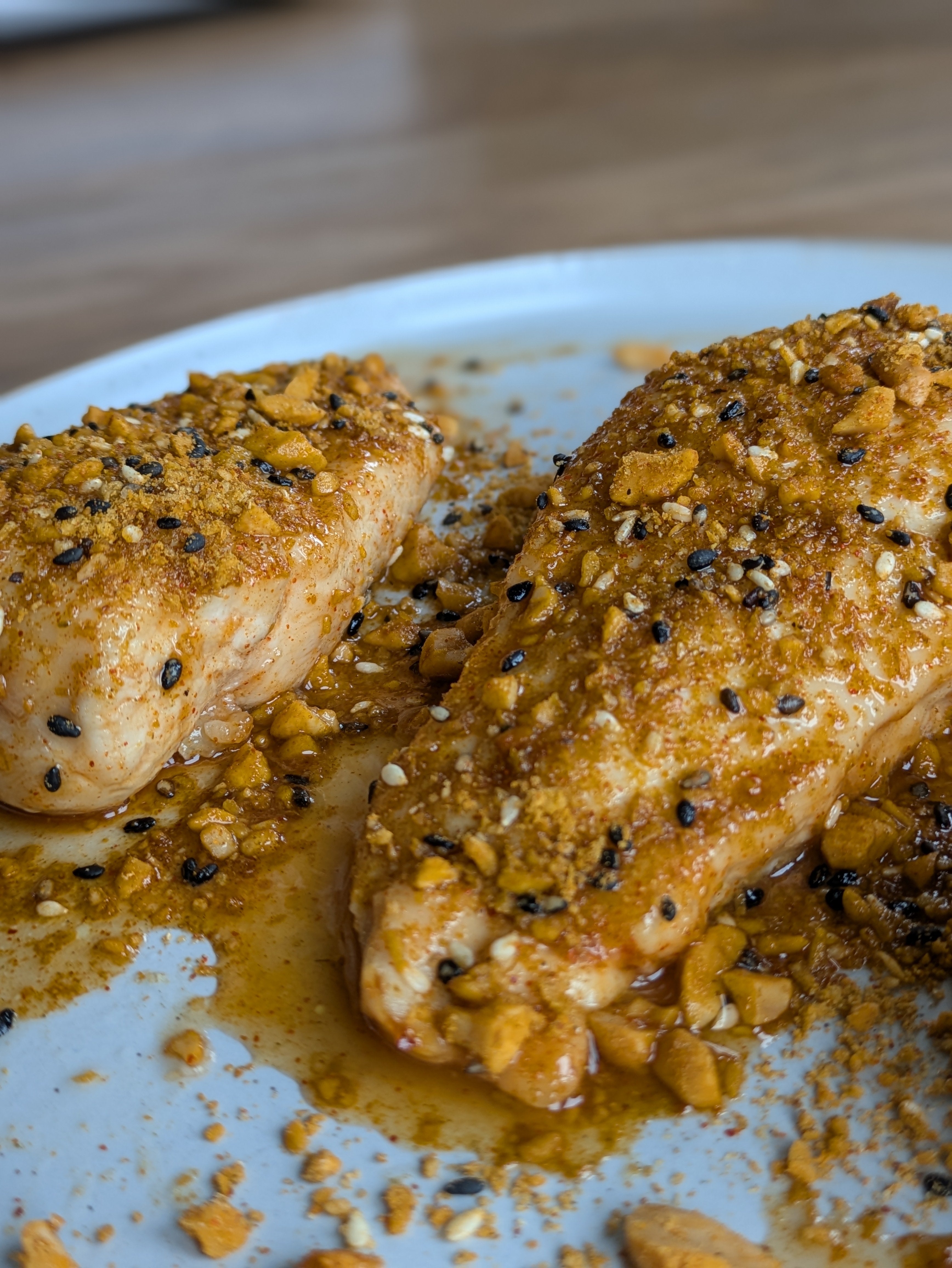 Hot honey roasted chicken rice bowl with kimchi, peanut crunch and black garlic sauce