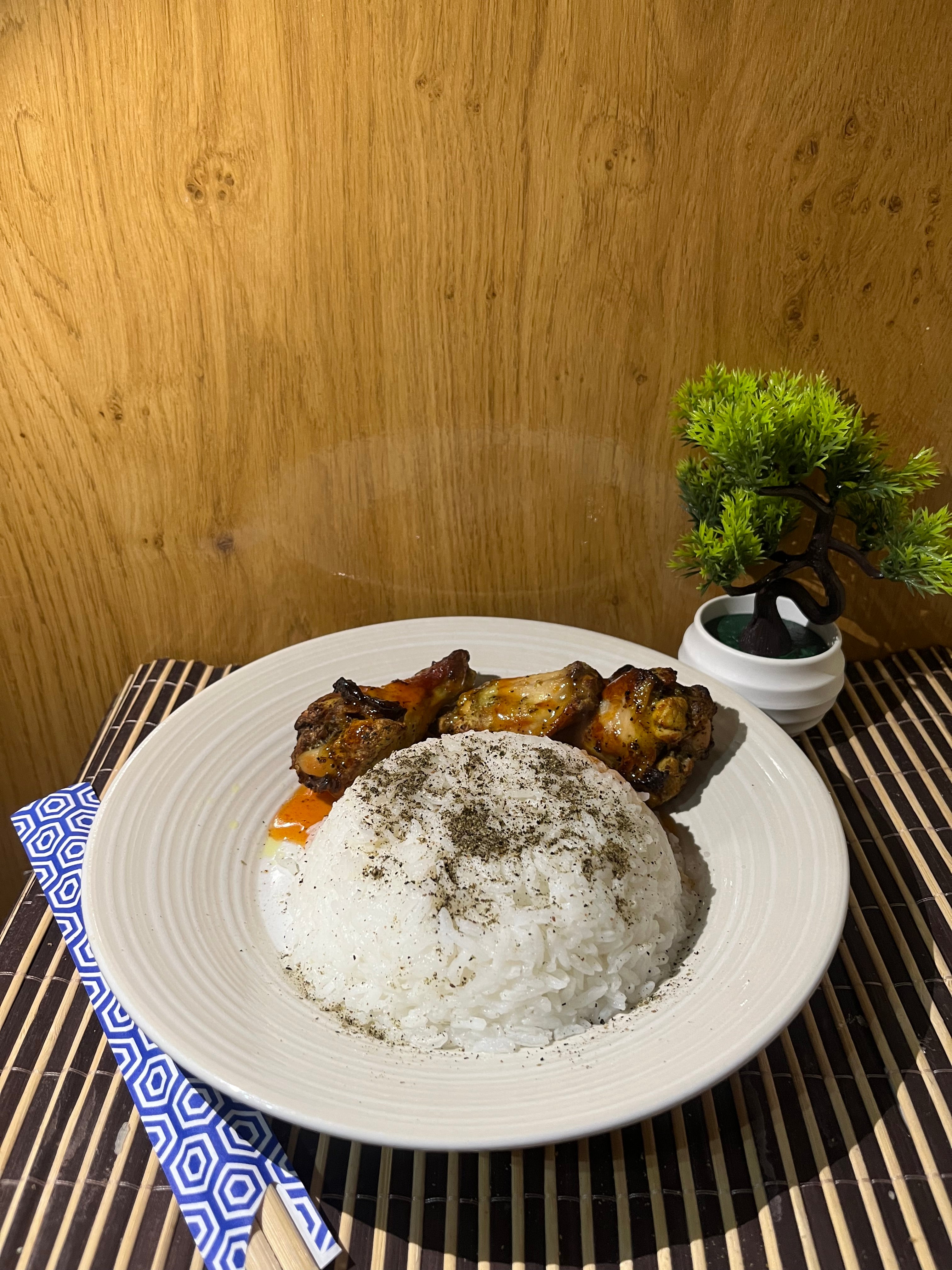 Hot honey chicken wings with a side of umami-seasoned rice.